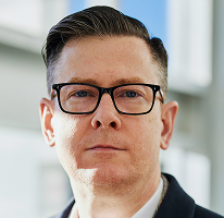 CEO and executive at a crypto trading company, Alexander Hughes, headshot